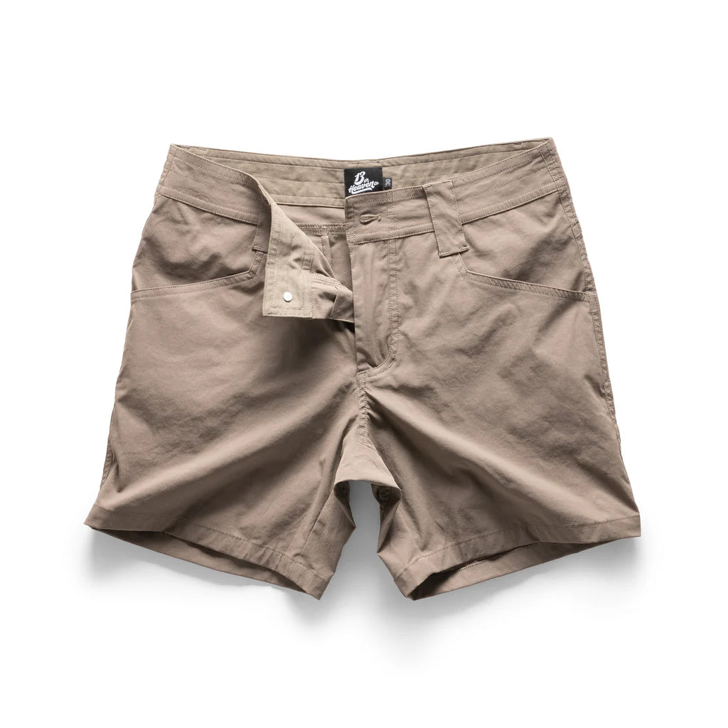 Beige shorts with a brand label on a white background