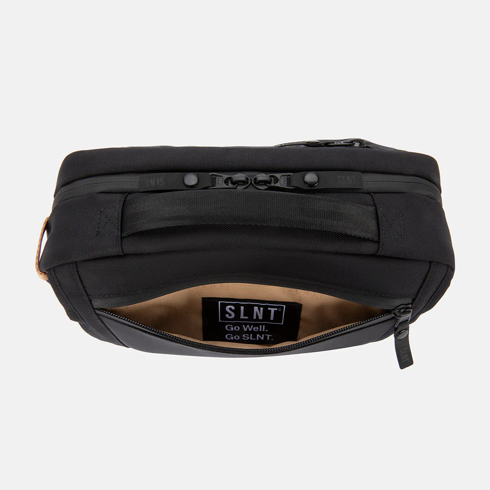 Arial view of SLNT E3 Faraday Crossbody Organizer Bag with back pocket opened and logo stitched inside 