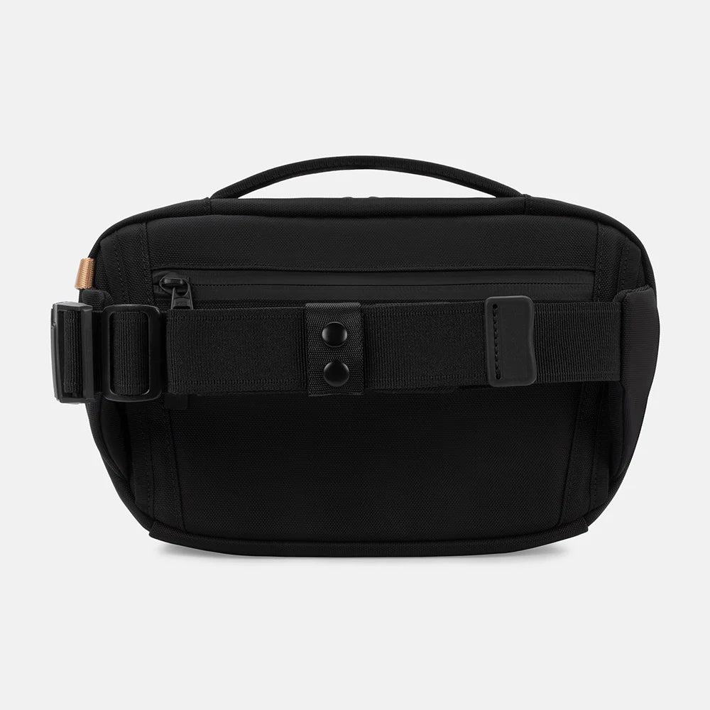 Back of SLNT E3 Faraday Crossbody Organizer Bag with strap and handle at the top